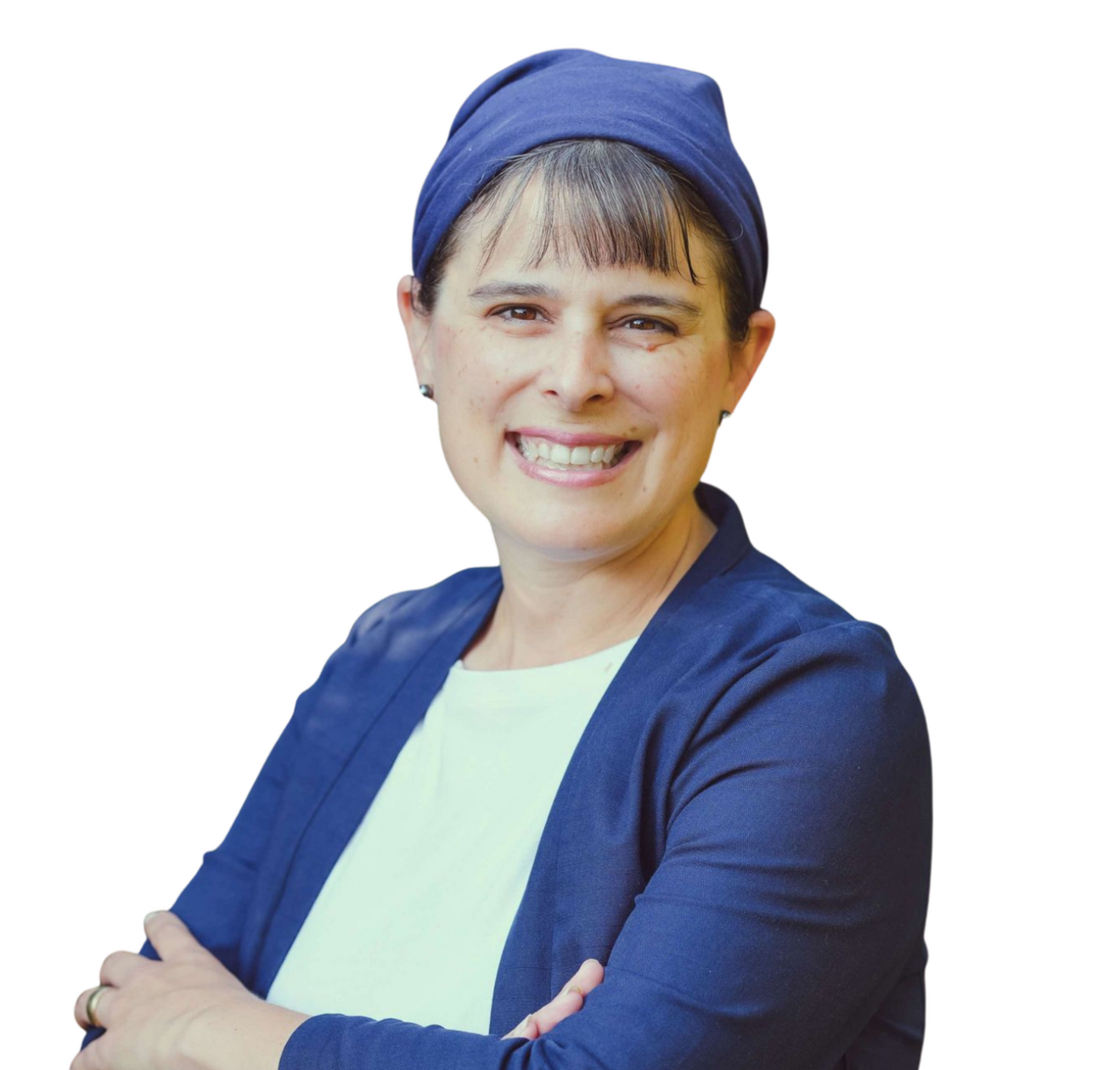 Jennifer Elia is wearing a blue jacket, a white shirt, and a matching blue head scarf. She has her arms folded in front of her